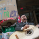 A demonstrator dances and sings along with the Mariachi Tapatio de Alvaro Paulino band as they perform during a demonstration across the street from the building that once housed the office space of Aaron Schlossberg on May 18, 2018, in New York City,
